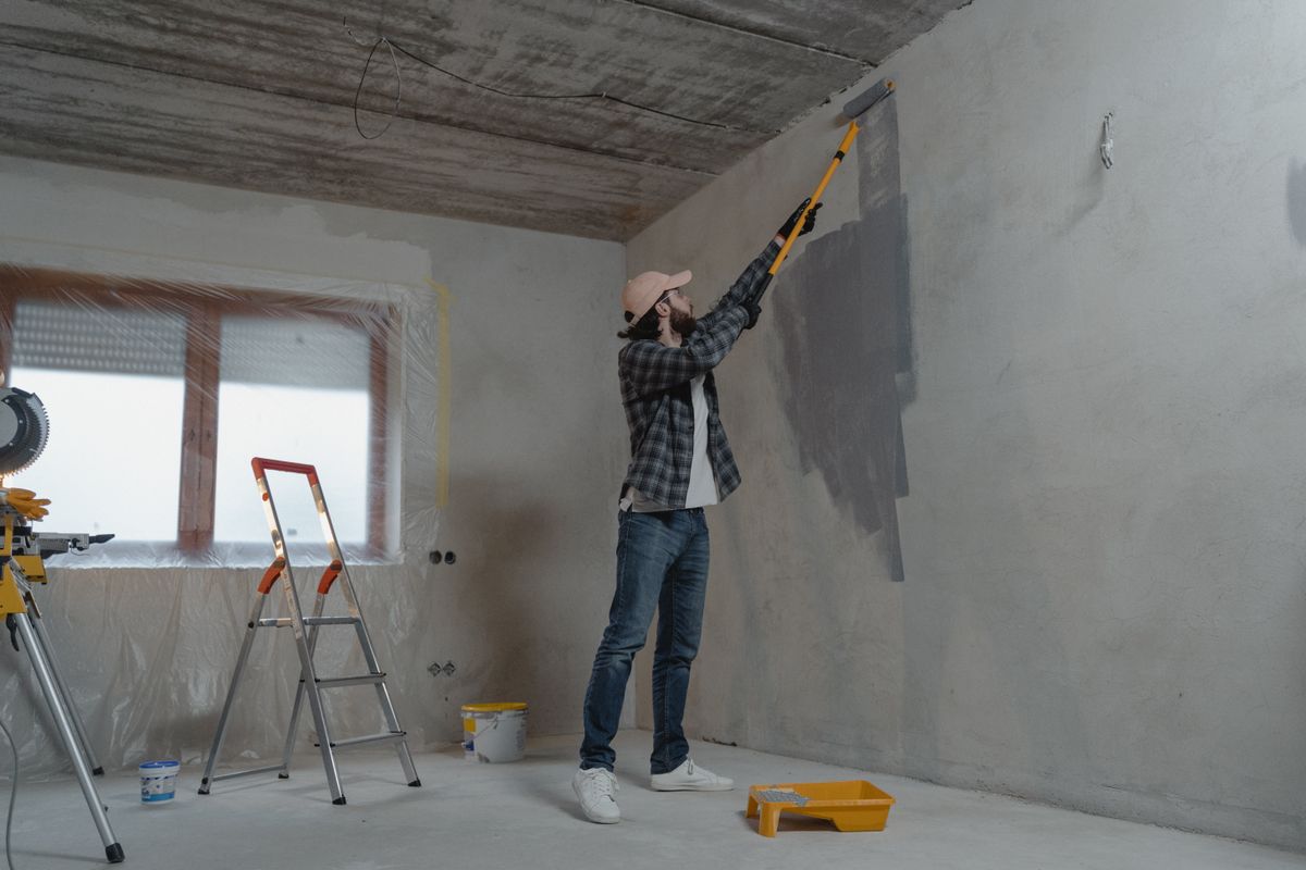 Contractor repainting the room
